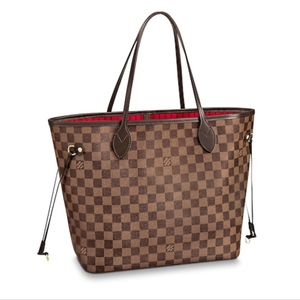 Louis Vuitton medium neverfull along with clutch /wristlet sold with bag.